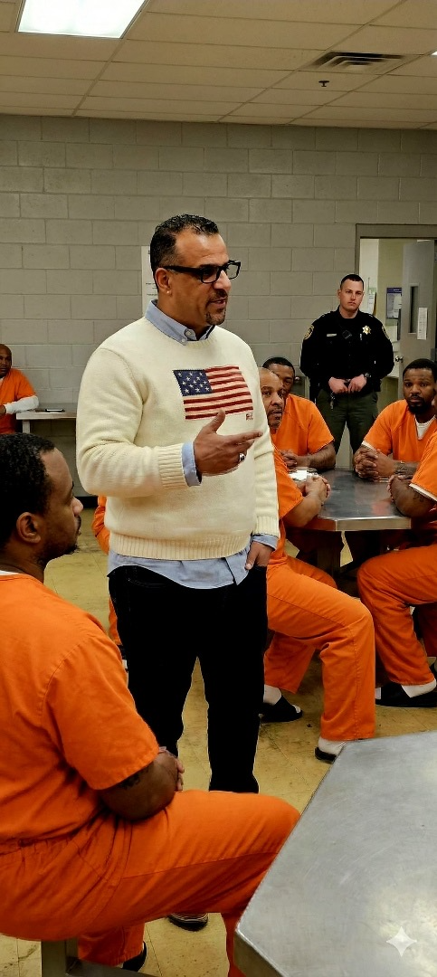 Pastor Lucho preaching in prison